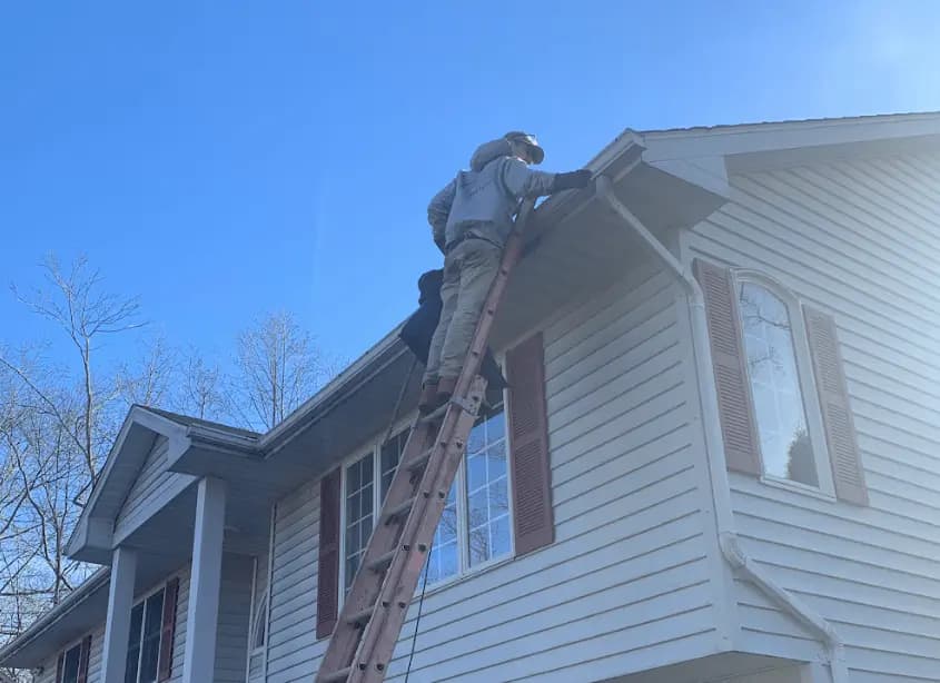 Gutter cleaning and maintenance being performed by Solon Power Washing in Solon