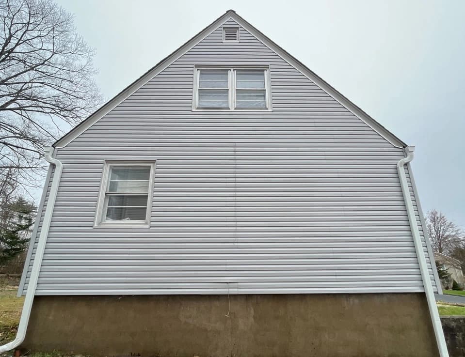 Solon Power Washing technician performing detailed house washing in Solon residential area